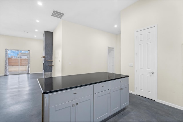 kitchen with gray cabinetry and a kitchen island