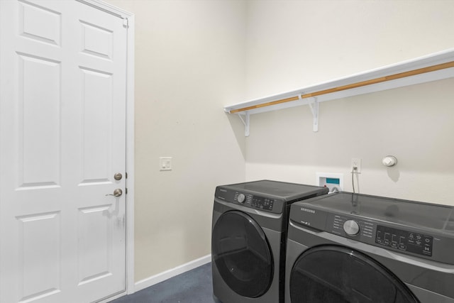 washroom featuring washing machine and dryer