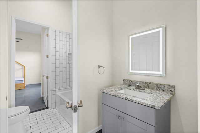 full bathroom with tile patterned floors, toilet, vanity, and tiled shower / bath combo