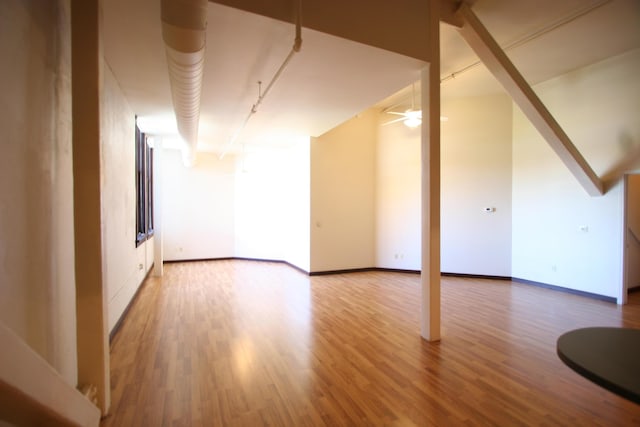 bonus room with hardwood / wood-style flooring and ceiling fan