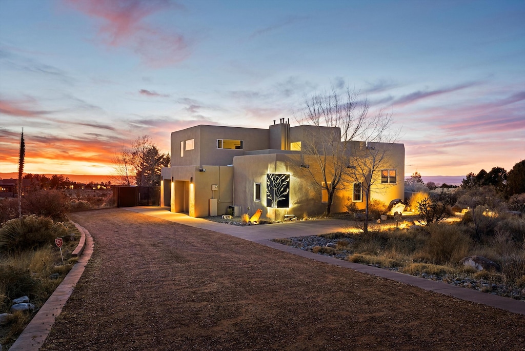 adobe home featuring a garage