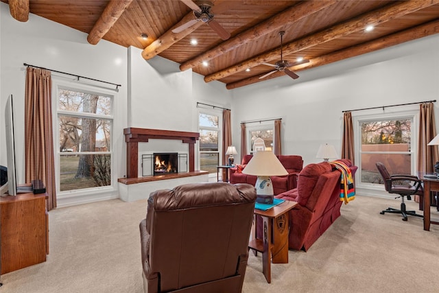 living room featuring ceiling fan, wooden ceiling, light colored carpet, and beam ceiling