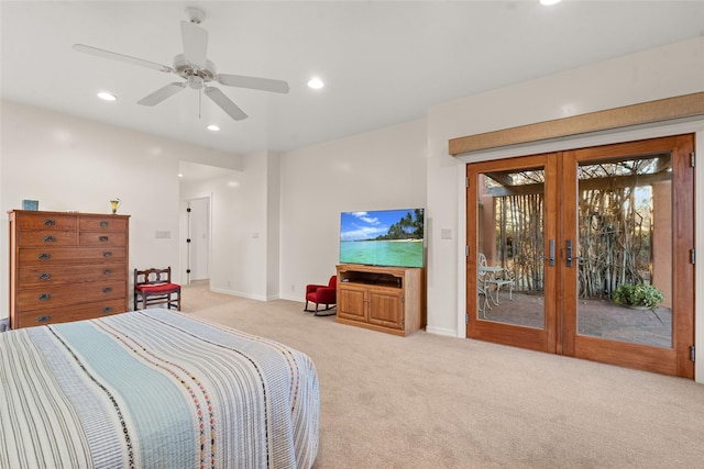 carpeted bedroom with access to outside, ceiling fan, and french doors