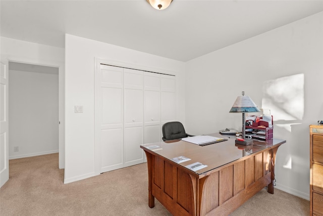 office area featuring light colored carpet