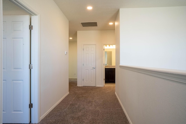 corridor with carpet floors