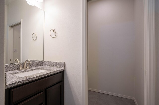 bathroom with tile patterned flooring and vanity