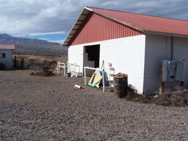 view of outbuilding featuring a mountain view