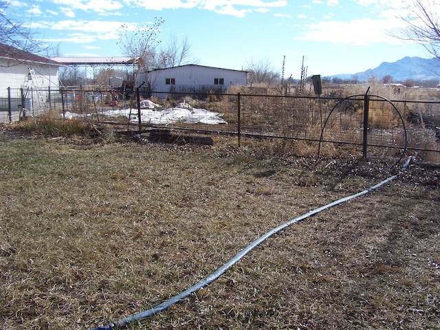 view of yard featuring a mountain view and a rural view