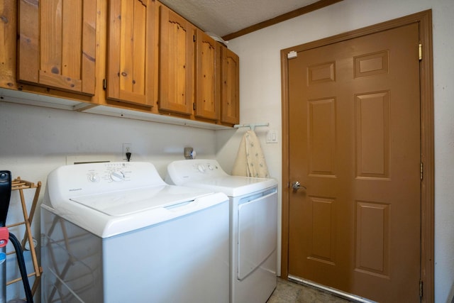 laundry area featuring cabinets, independent washer and dryer, and a textured ceiling