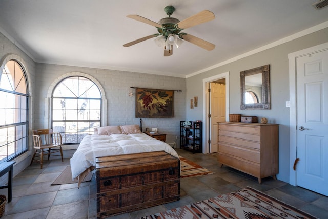 bedroom featuring ornamental molding and ceiling fan