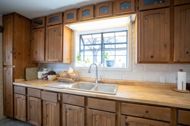 kitchen with tasteful backsplash and sink