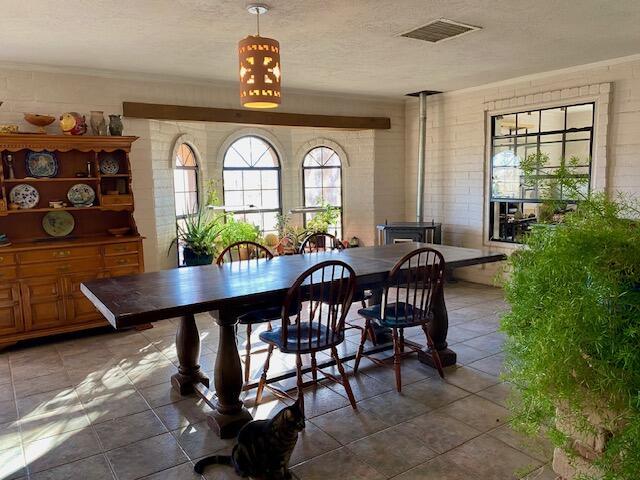 dining area with a textured ceiling