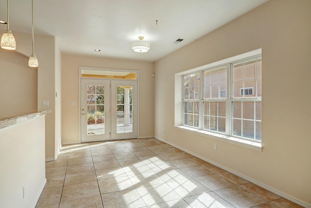 entryway with light tile patterned flooring