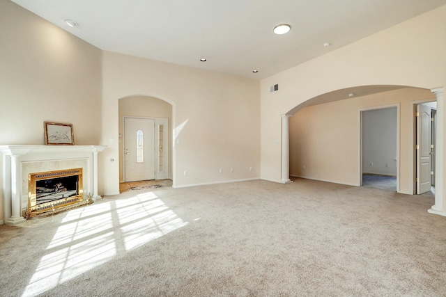 unfurnished living room with light carpet