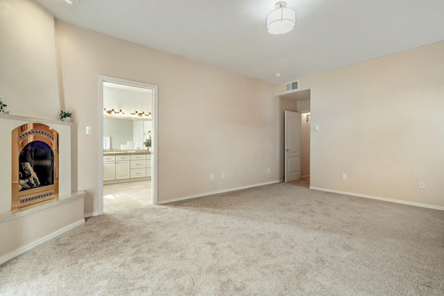 interior space featuring light colored carpet