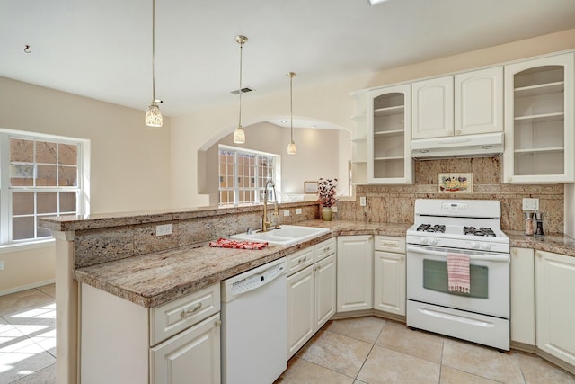 kitchen featuring kitchen peninsula, decorative light fixtures, white appliances, light tile patterned flooring, and sink