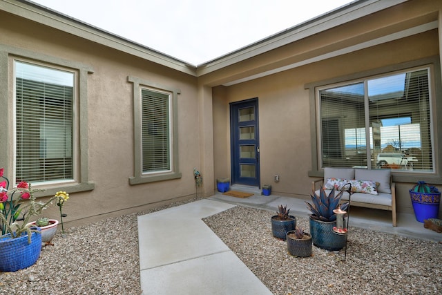 property entrance featuring a patio area