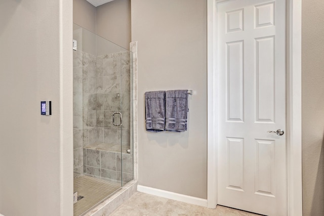 bathroom with walk in shower and tile patterned floors