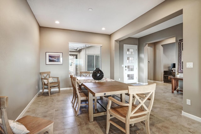 dining room with recessed lighting, baseboards, and light tile patterned floors