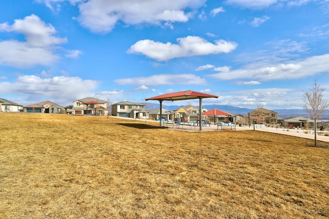 view of property's community with a gazebo and a yard