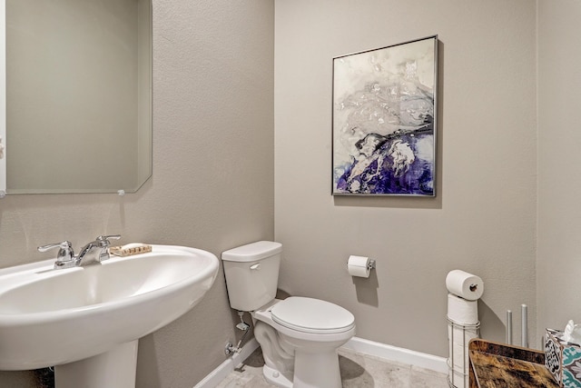 bathroom with sink and toilet