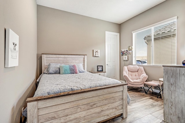 bedroom with light wood-type flooring