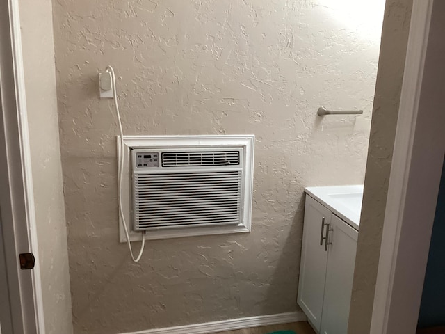 bathroom featuring vanity and a wall unit AC