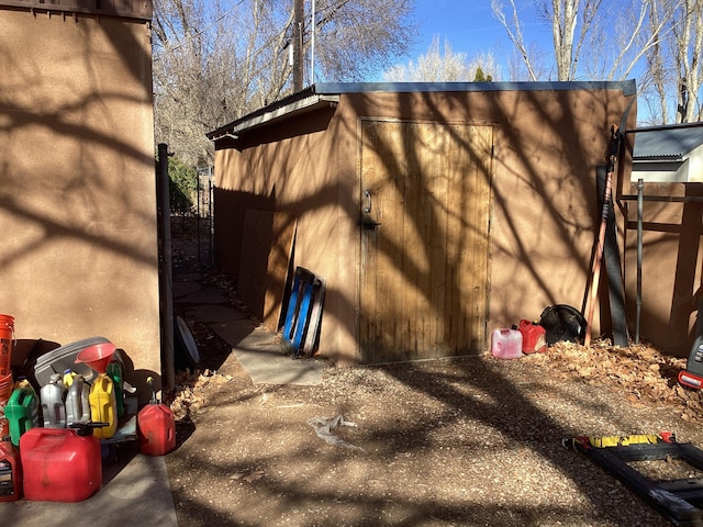 exterior space featuring a storage unit