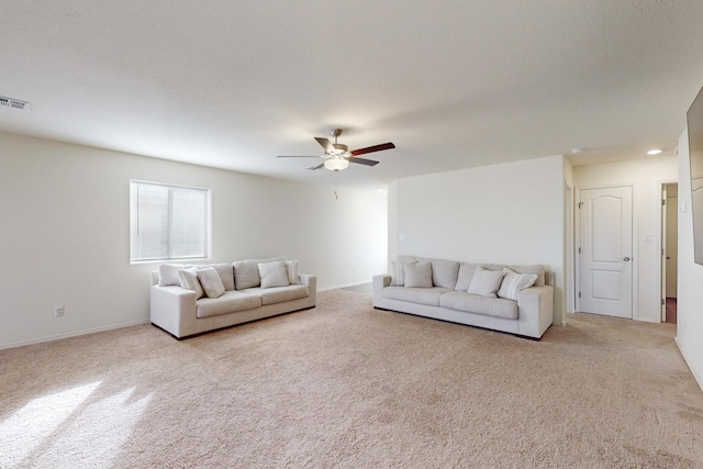 living room featuring light carpet and ceiling fan