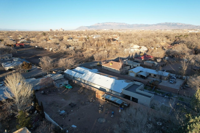 birds eye view of property with a mountain view