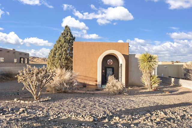 view of pueblo revival-style home