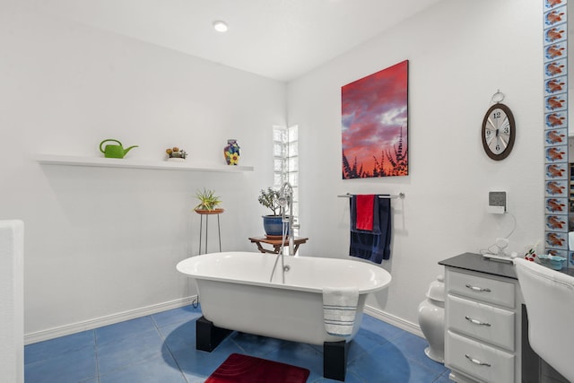 bathroom with tile patterned floors and a bathtub