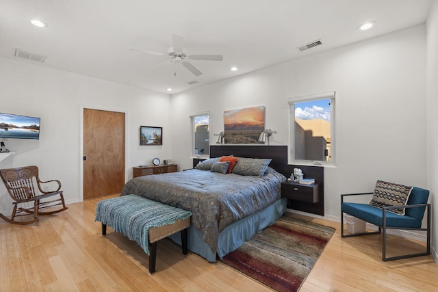 bedroom with light hardwood / wood-style flooring and ceiling fan