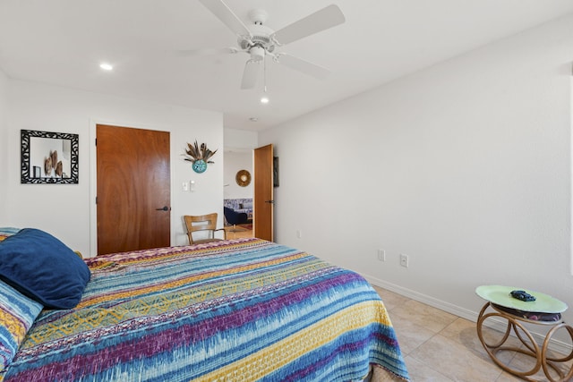 bedroom with light tile patterned floors and ceiling fan