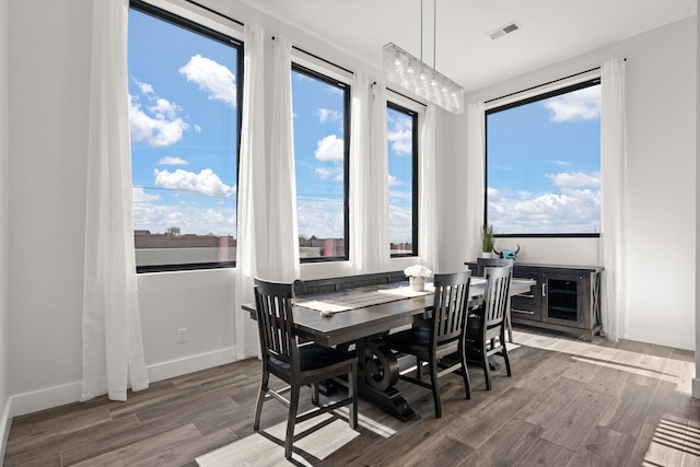 dining area with hardwood / wood-style floors