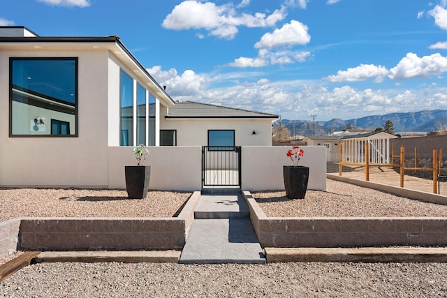 view of property exterior featuring a mountain view