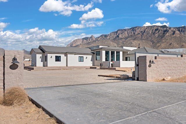 ranch-style home featuring a mountain view