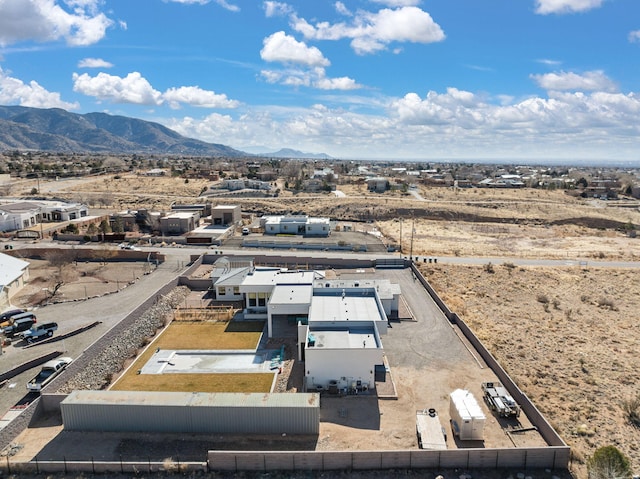 birds eye view of property with a mountain view