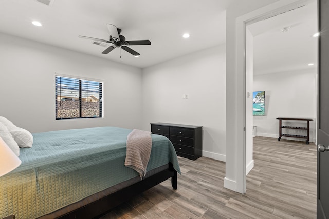 bedroom featuring ceiling fan and light hardwood / wood-style flooring