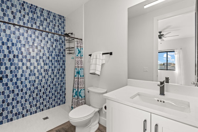 bathroom featuring ceiling fan, vanity, toilet, and a shower with shower curtain