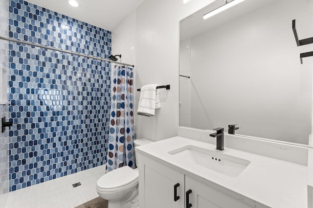 bathroom with vanity, toilet, and a shower with shower curtain