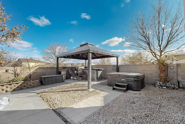 view of patio / terrace with a gazebo and a hot tub