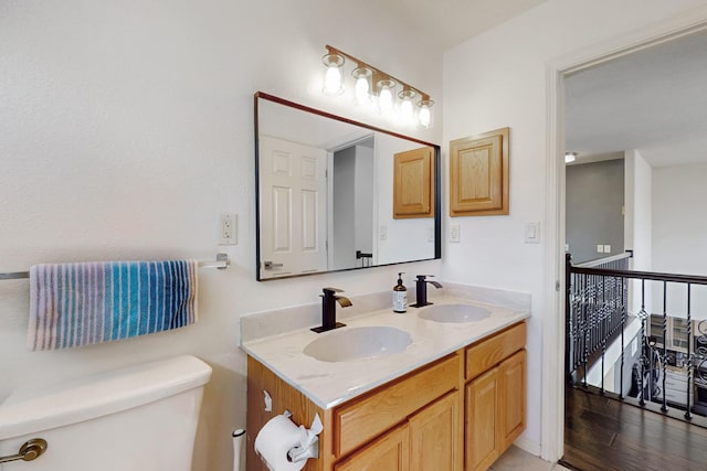 bathroom with toilet and vanity