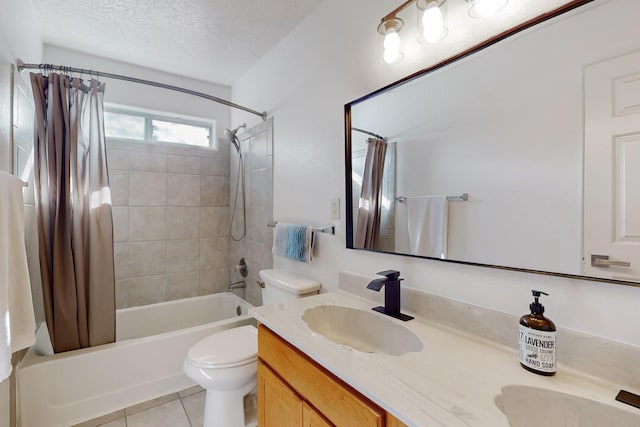 full bathroom featuring a textured ceiling, tile patterned floors, vanity, toilet, and shower / bath combo with shower curtain