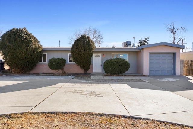 ranch-style house featuring a garage