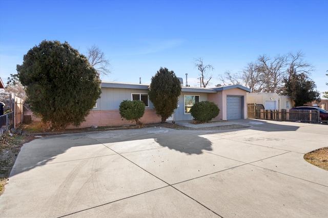 ranch-style home featuring a garage