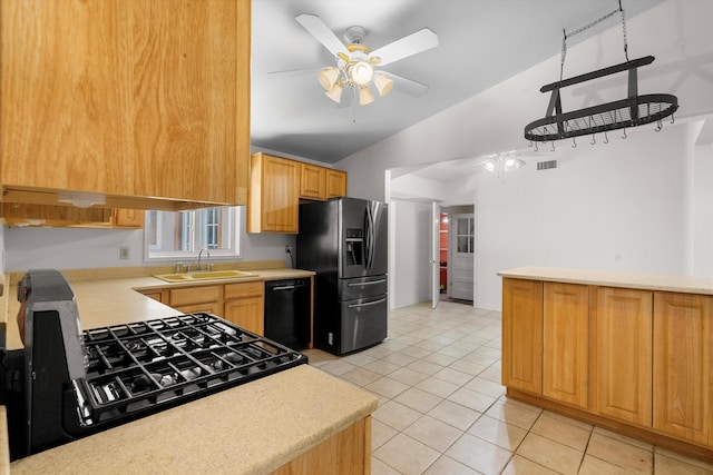 kitchen with stainless steel fridge with ice dispenser, dishwasher, light tile patterned floors, sink, and vaulted ceiling