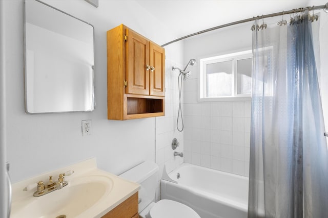 full bathroom with vanity, toilet, and shower / tub combo with curtain