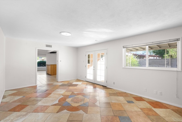 empty room featuring french doors