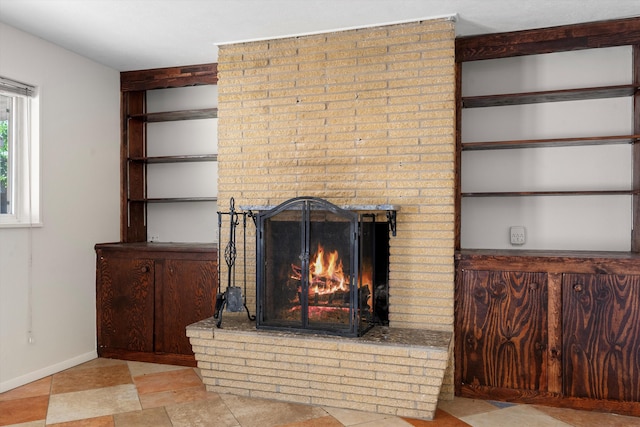 interior details with built in shelves and a fireplace